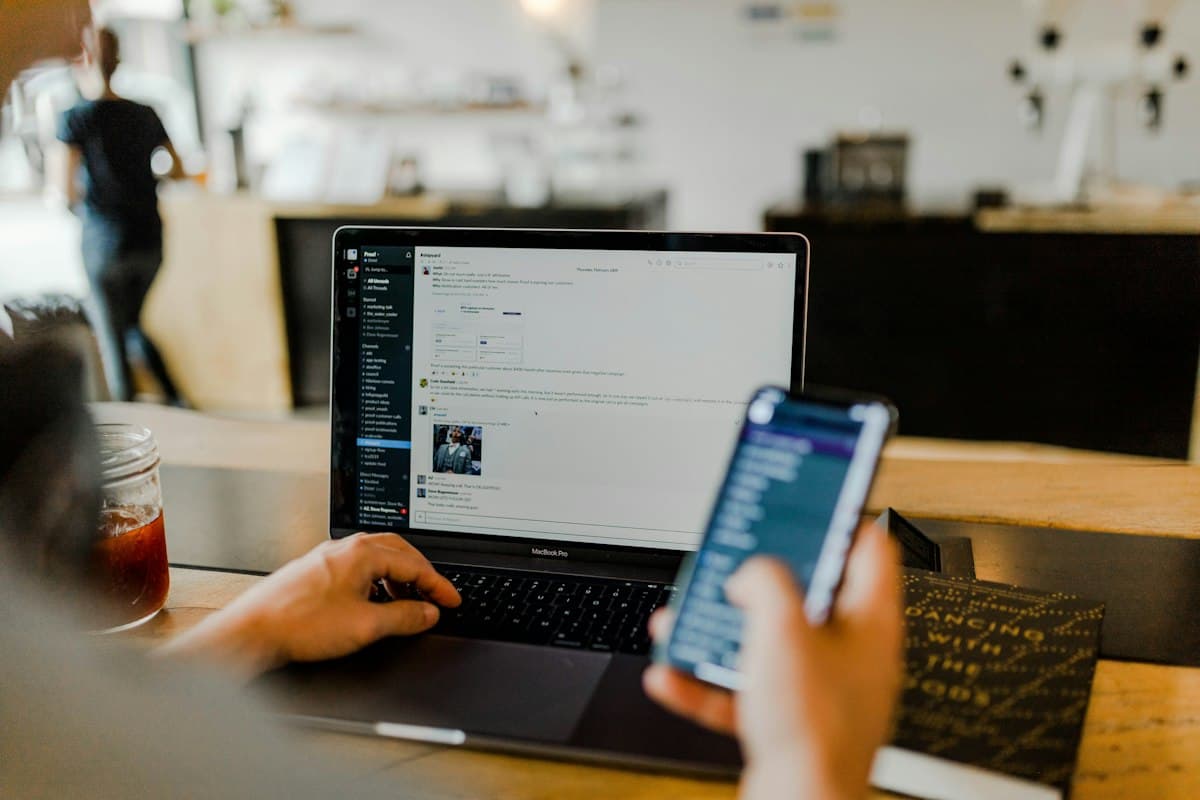 Agent using a laptop and phone